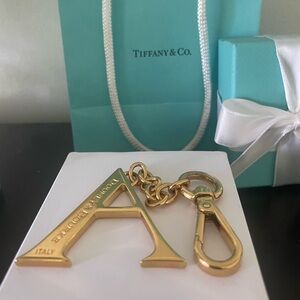 Beautiful Dooney Bourke Gold Toned “A” initial bag charm or key chain.